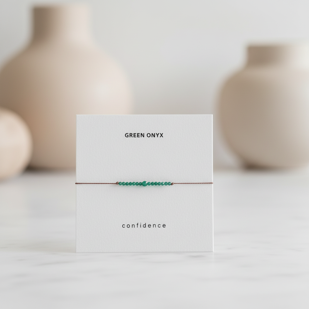 Green onyx bracelet on card with neutral background